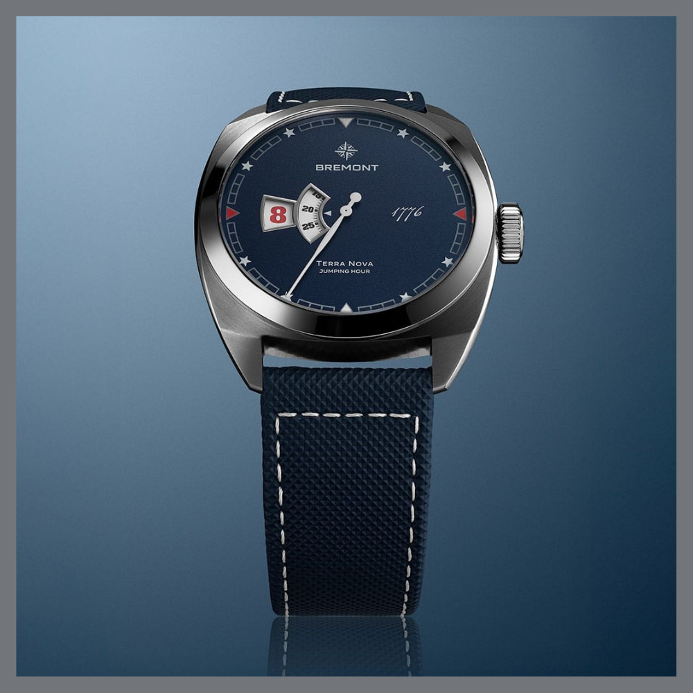 america250 11 | Feldmar Watch Co. Close-up of Bremont Terra Nova jumping-hour wristwatch with a blue dial and matching navy strap.