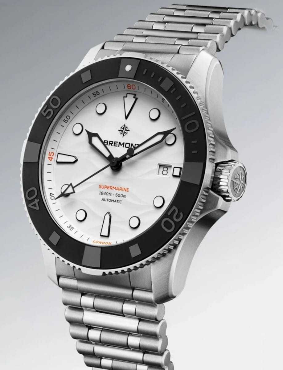 Stainless steel Bremont Supermarine diver's watch with white dial, black ceramic unidirectional bezel, and date window at 3 o'clock on a steel bracelet.