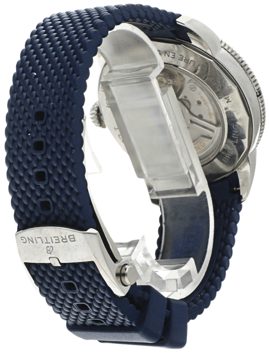 Breitling wristwatch with a blue textured strap, metal clasp, and a view of the exposed mechanical movement on the back.