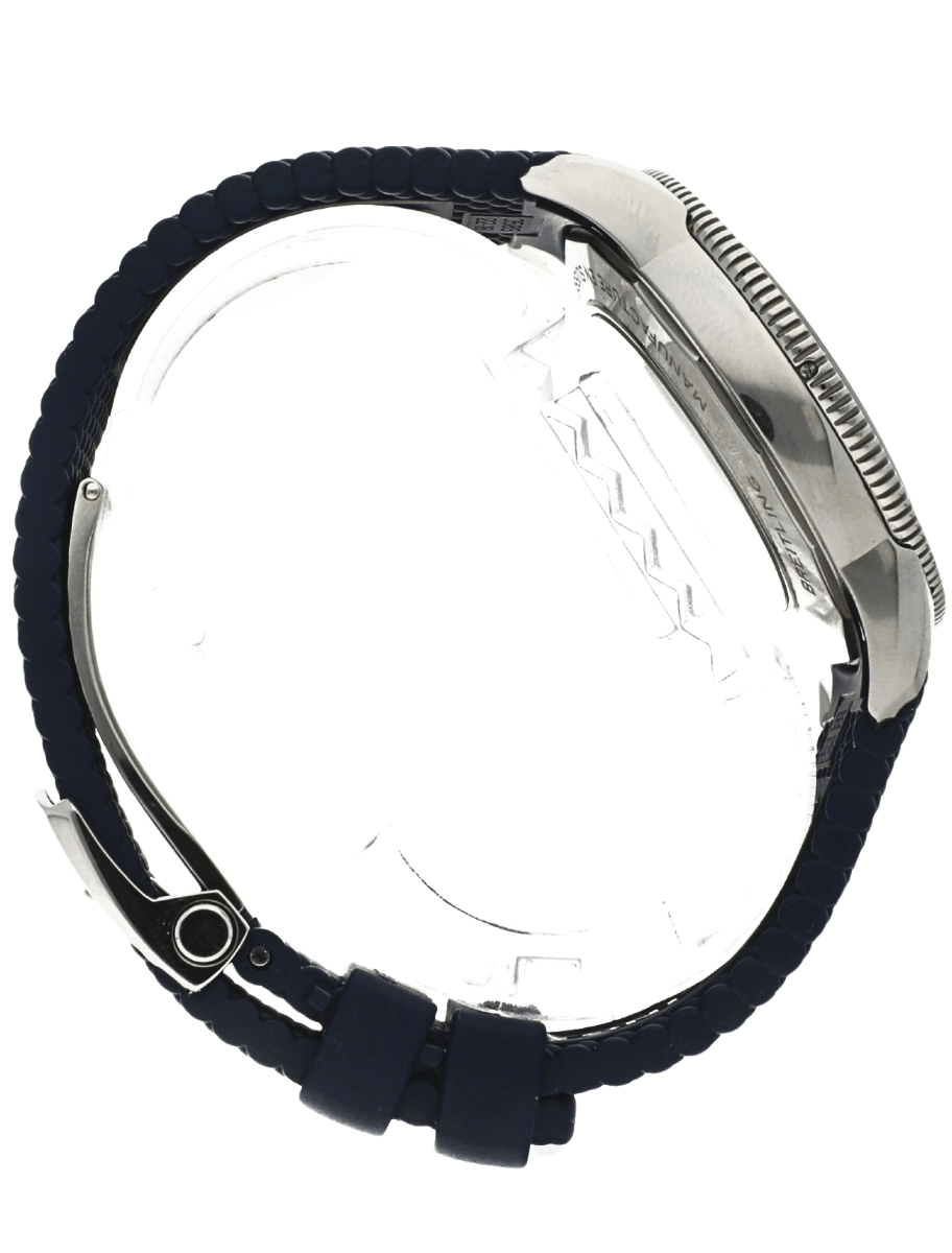 Side view of a pre-owned Breitling wristwatch with a blue textured strap and a knurled crown visible on the right edge.