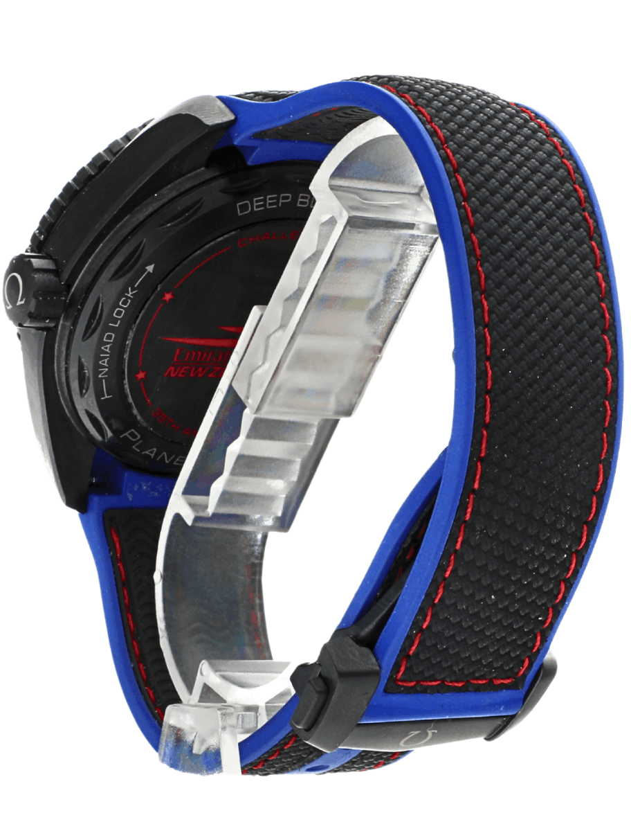 Back side view of pre-owned Omega Seamaster analog wristwatch with a black dial, blue strap with red stitching, and a black ceramic case.