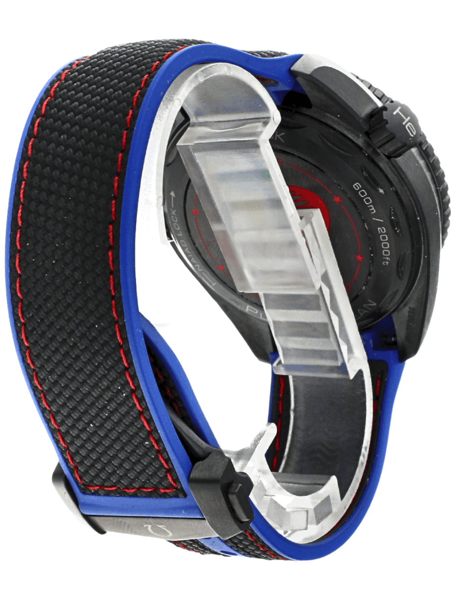 Back side view of pre-owned Omega Seamaster analog wristwatch with a black dial, blue strap with red stitching, and a black ceramic case.