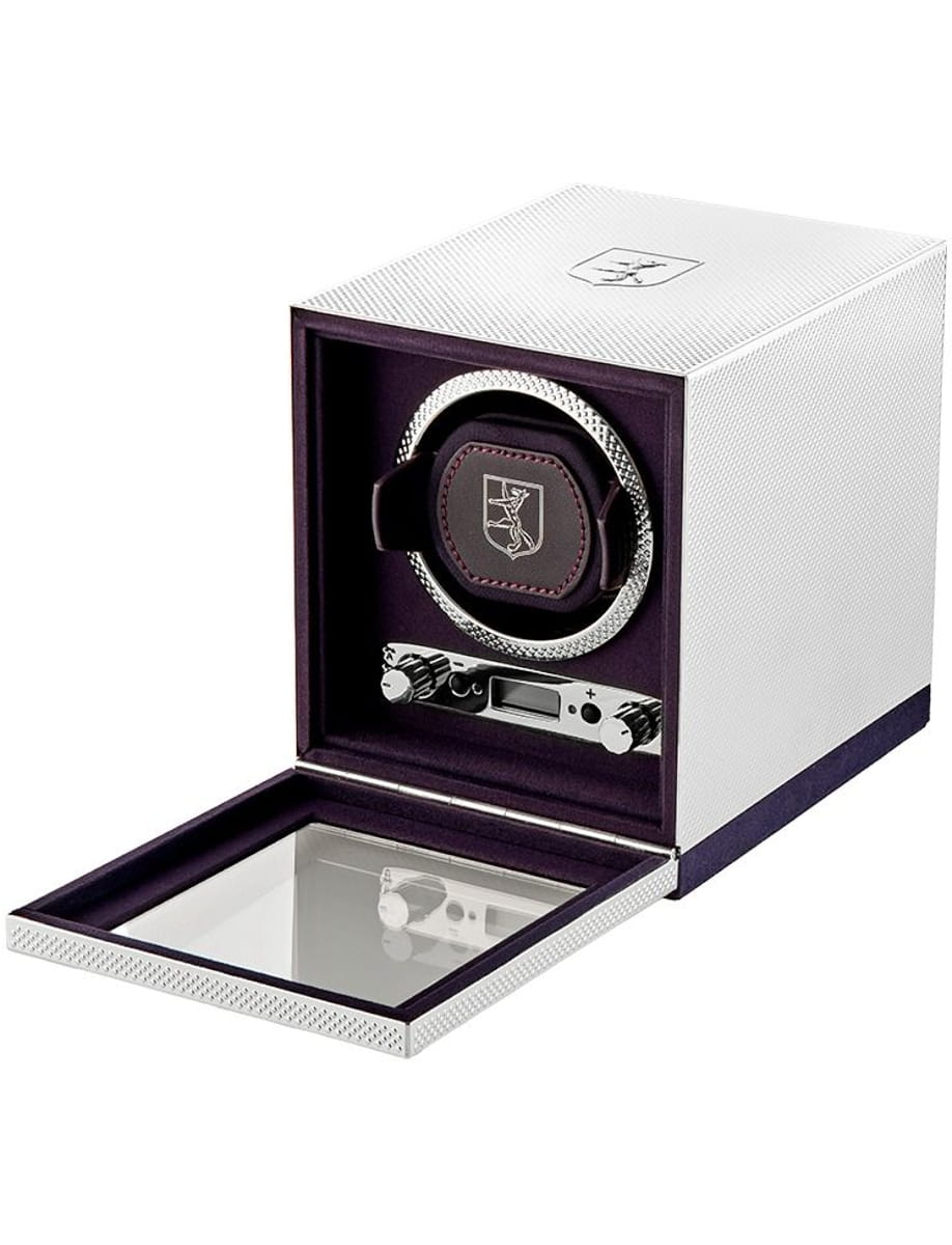 Luxury silver watch winder box with purple interior, open to show a round-wristwatch on the rotor and control panel inside