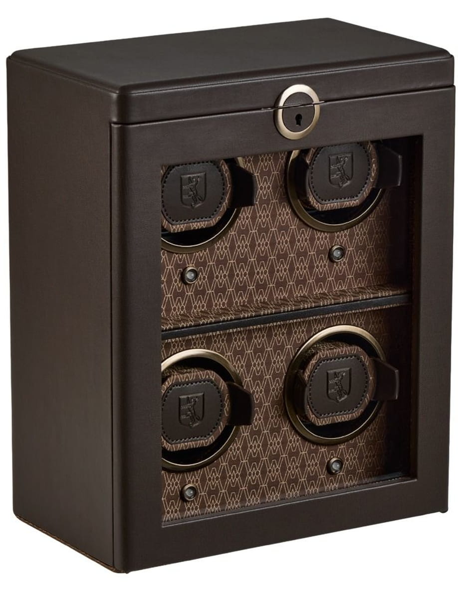 Small dark brown safe with four round combination dials on the front and a keyhole at the top center.