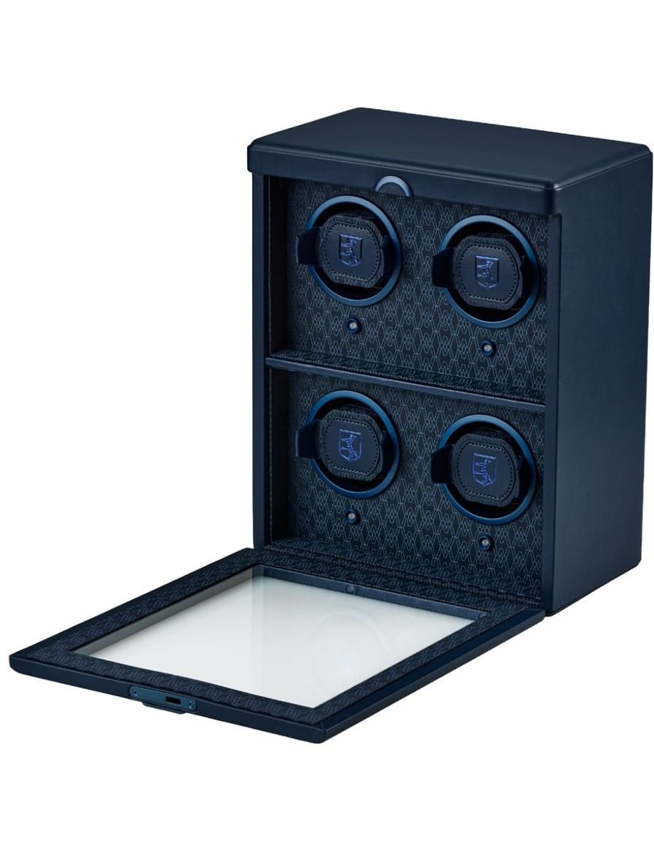 Blue safe with four circular watch winders inside, lid open and a glass lower drawer exposed.