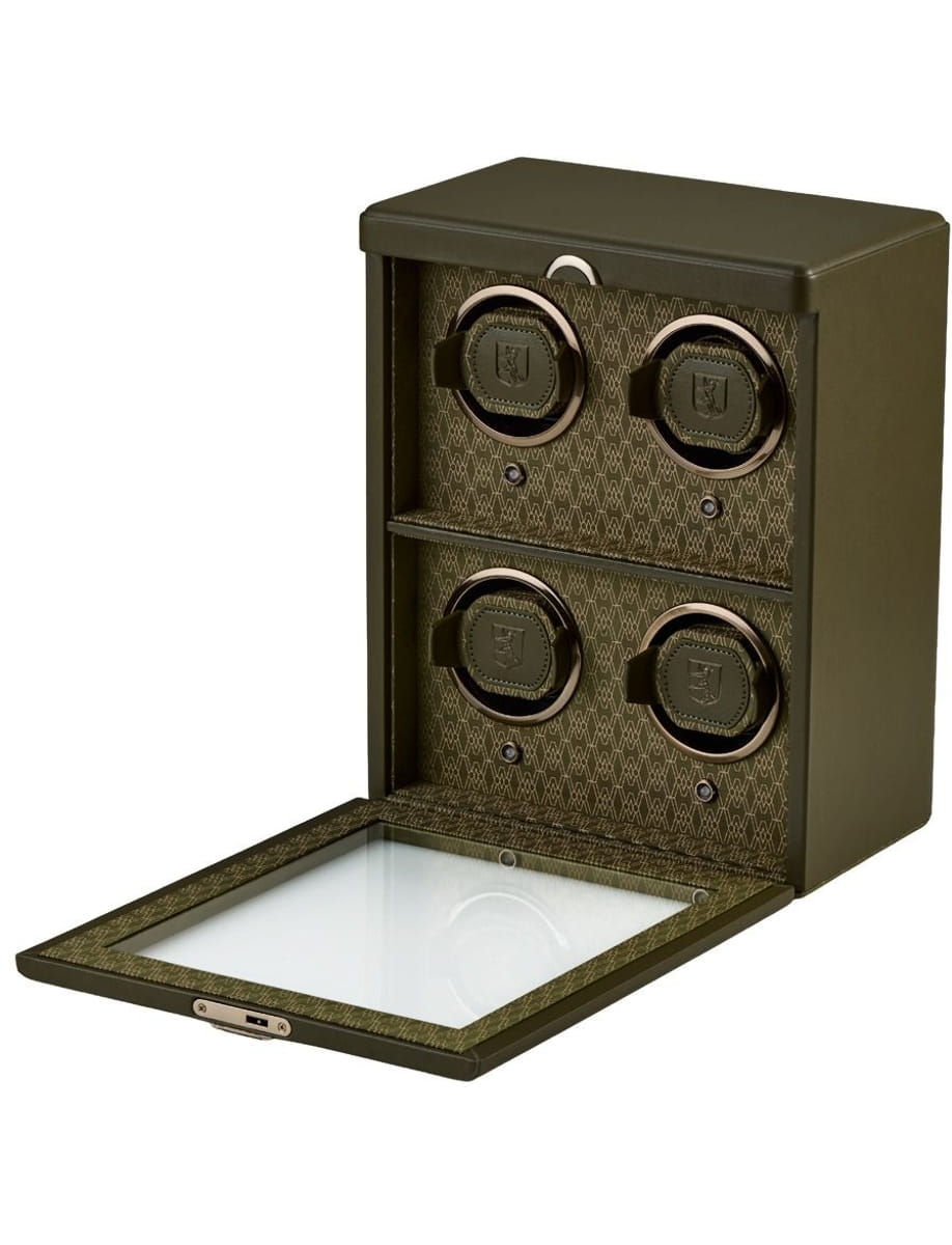 Olive green safe with four round combination dials, opened to reveal a glass-bottom compartment