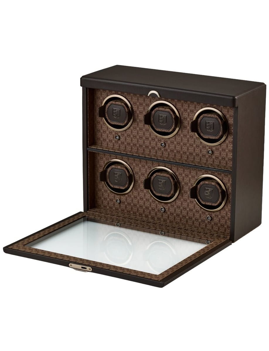 Six-slot luxury watch winder box with circular winders inside a brown case and glass top lid open to reveal interior.