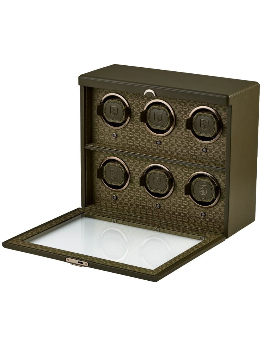 Olive-green watch-winder safe with six circular winders arranged in two rows and a glass-front drop-down door open.