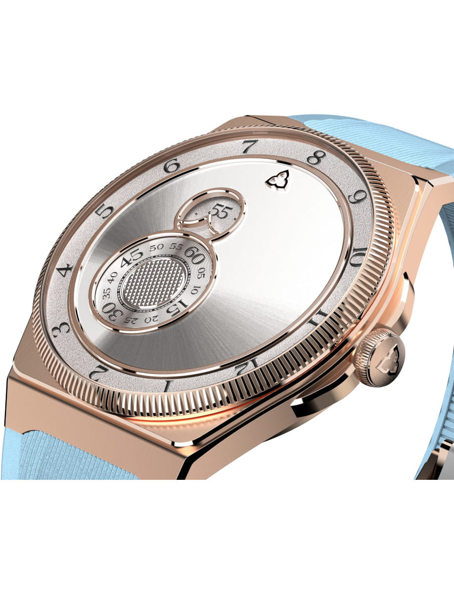 Close-up of a rose-gold wristwatch with a silver dial and light blue strap.