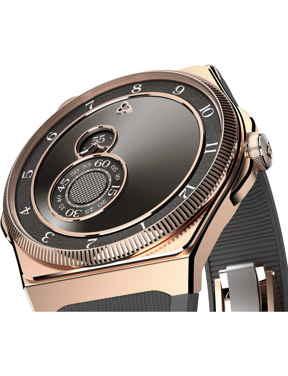 Close-up of a rose-gold luxury wristwatch with a black textured dial and rotating bezel.