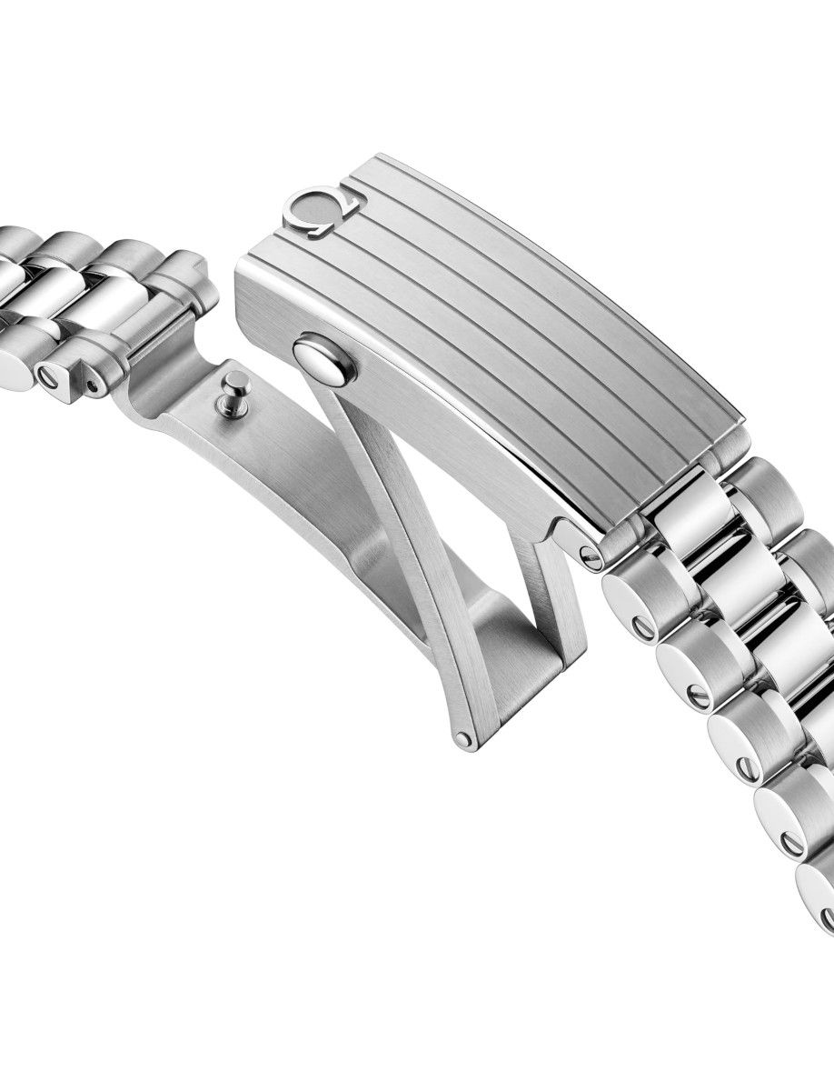 Close-up of a stainless steel watch band with a deployment clasp and brushed links.