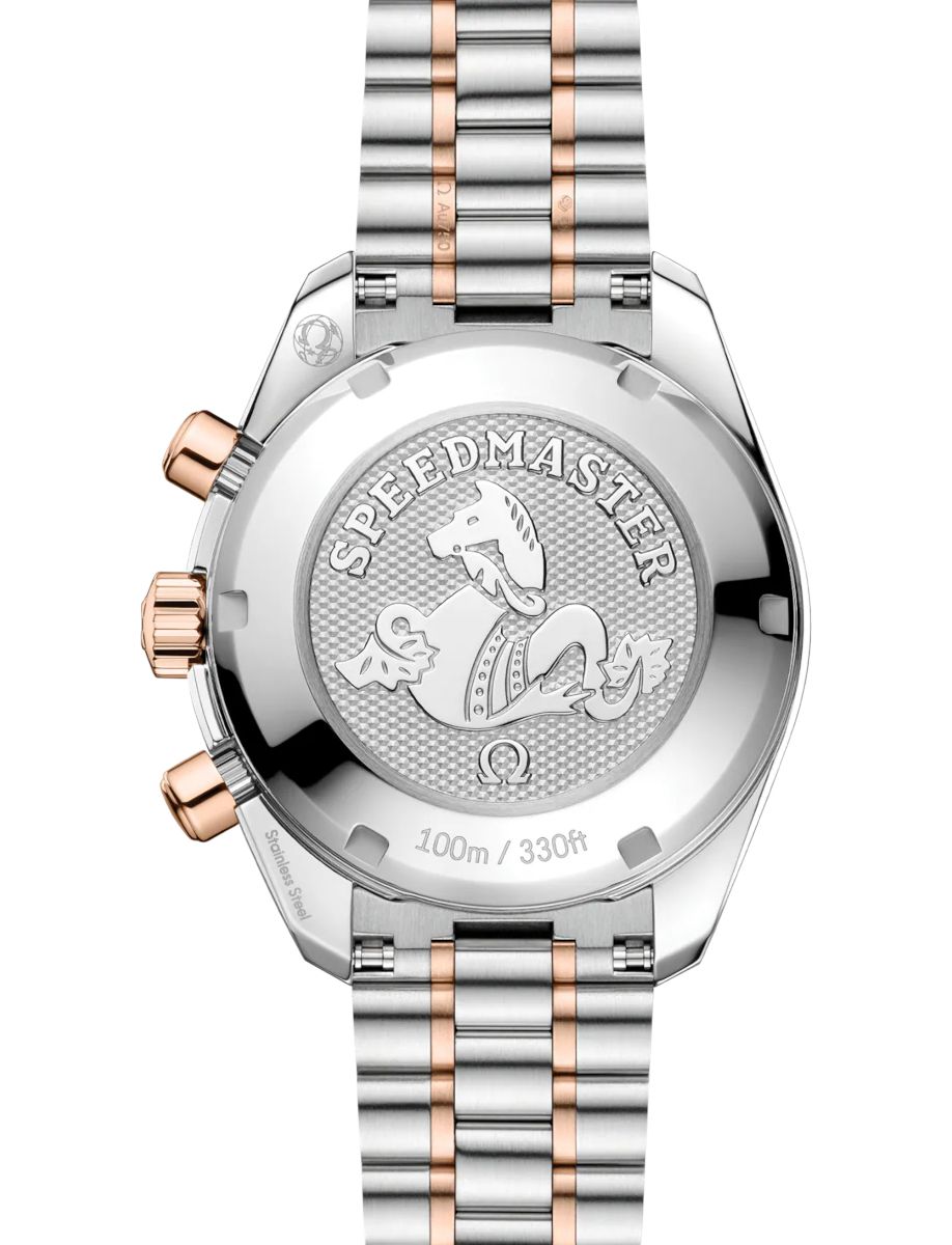 Back of a two-tone stainless steel Omega Speedmaster watch with seahorse emblem and 'SPEEDMASTER' engraving; water resistance 100m / 330ft visible.