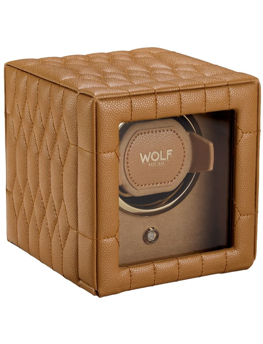 Brown quilted leather watch winder with a transparent front showing a Wolf watch winder inside.