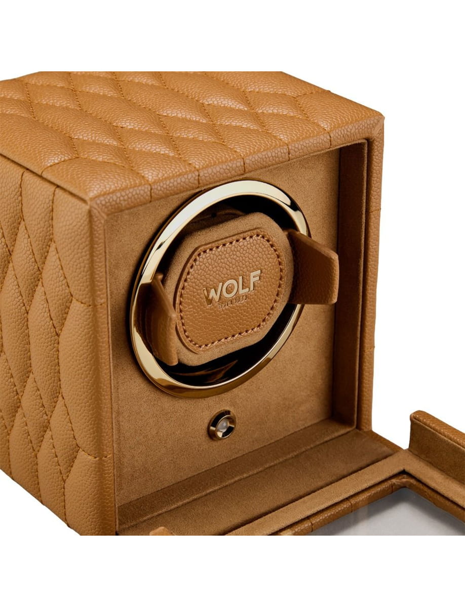 Tan quilted leather jewelry box with a gold circular lock and WOLF logo on the front