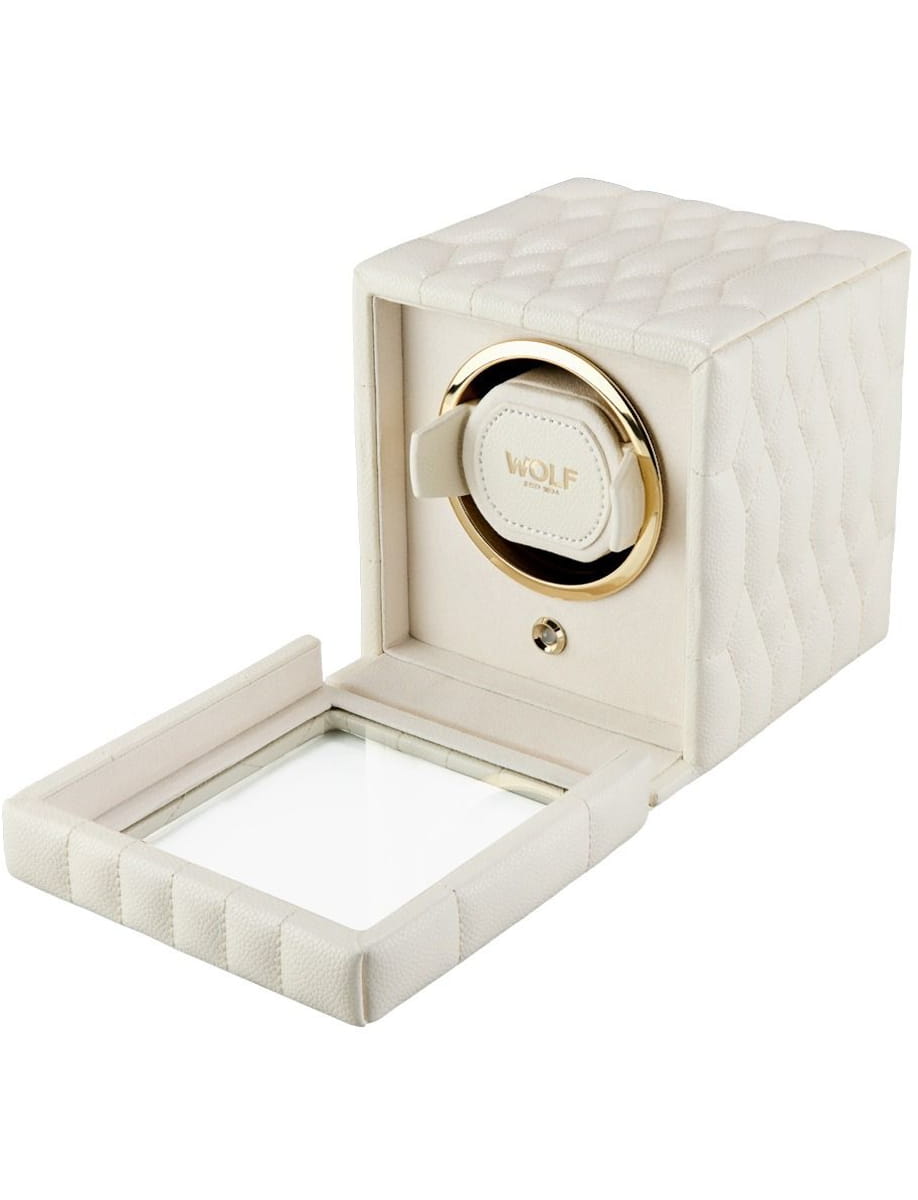 Side view of cream quilted leather watch winder safe with gold circular interior and Wolf logo on the lid cap set into a square box.