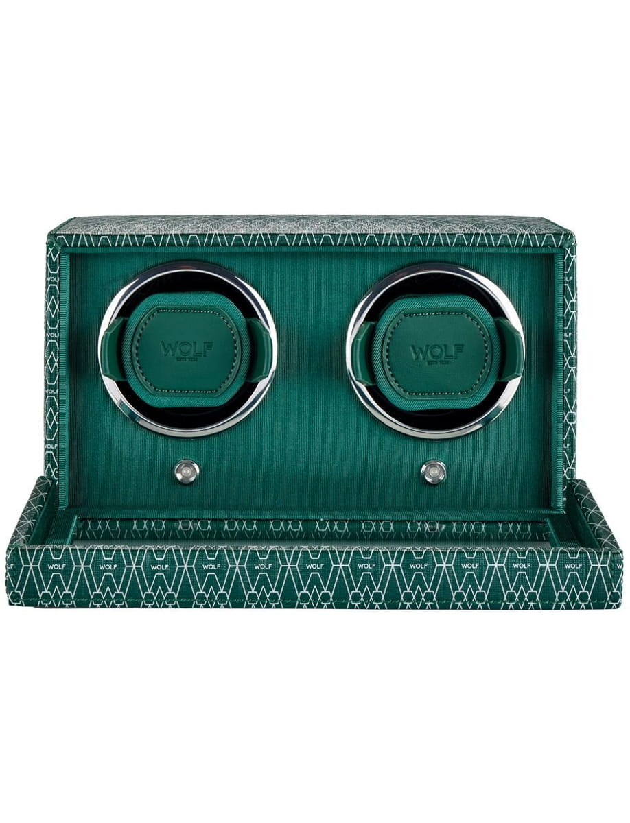 Teal Wolf over-ear headphones displayed in a matching teal patterned case, with chrome rings on the ear cups.