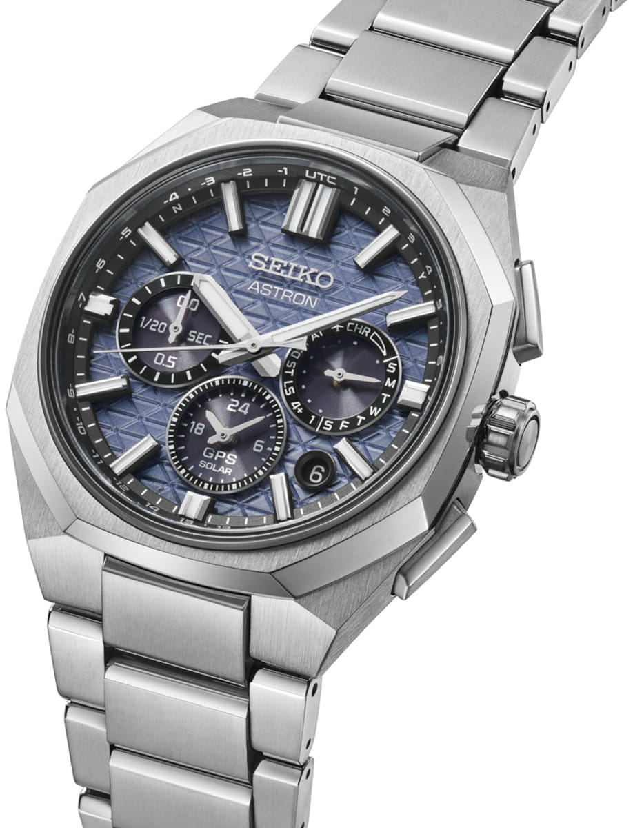 Seiko Astron stainless steel wristwatch with a blue textured dial and multiple subdials, on a metal bracelet (date at 4 o'clock).