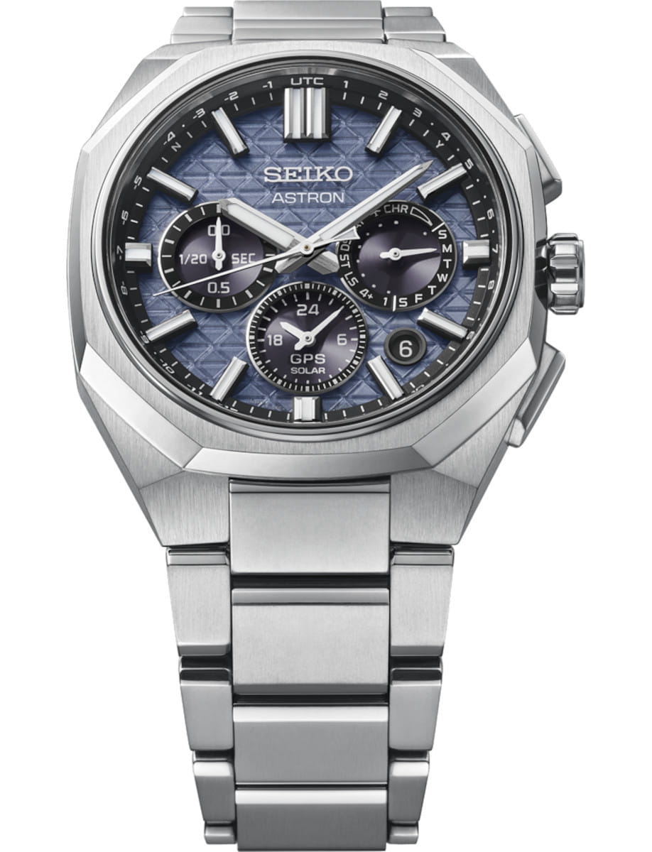 Stainless steel Seiko Astron watch with a blue patterned dial and multiple subdials, metal bracelet, and date window on the right side