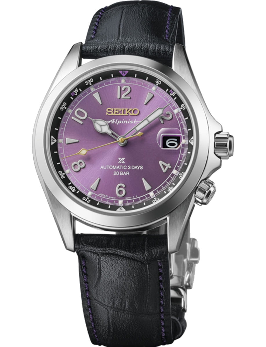 Seiko wristwatch with a purple dial, silver case, date window at 3 o'clock, and a black leather strap.