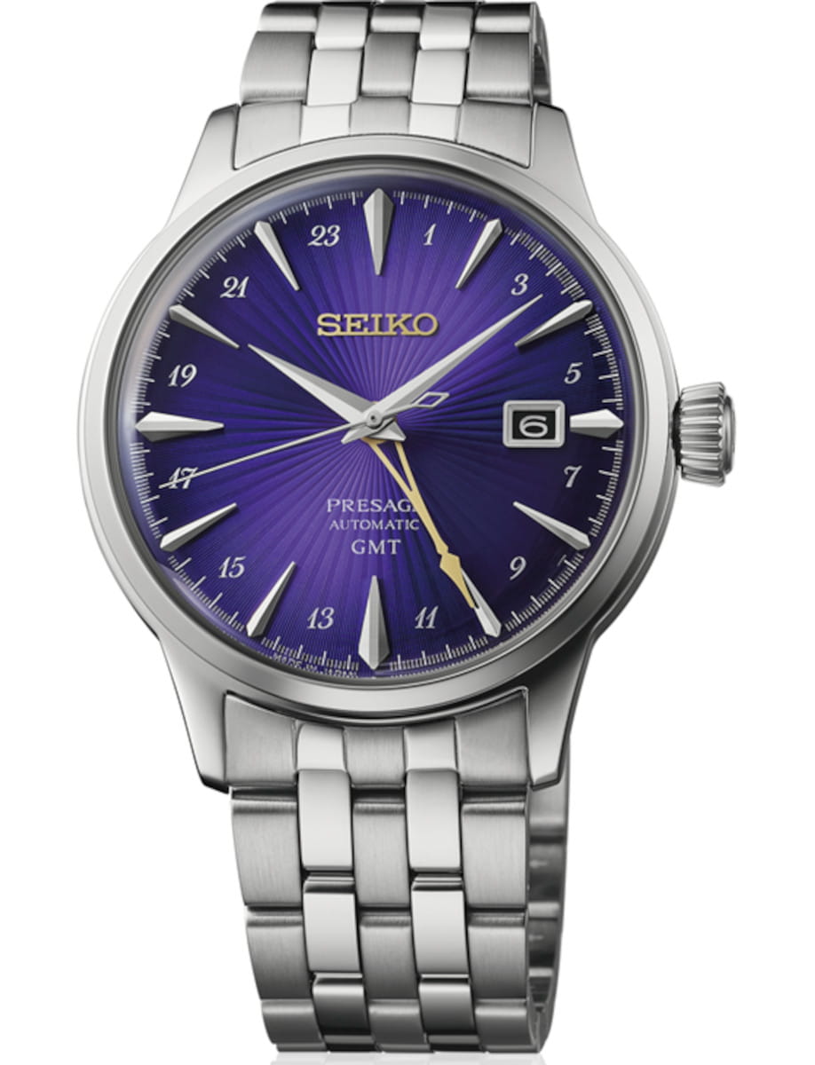 Seiko Presage GMT automatic watch with a purple sunburst dial and stainless steel bracelet, displaying date at 3 o'clock.