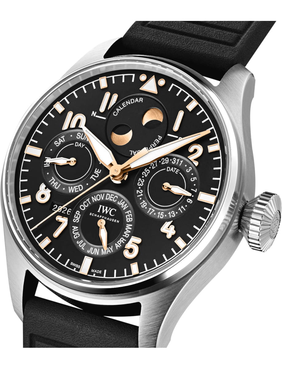 Black dial wristwatch with rose-gold hands and multiple subdials displaying date, day, month, and calendar indicators (IWC Schaffhausen).