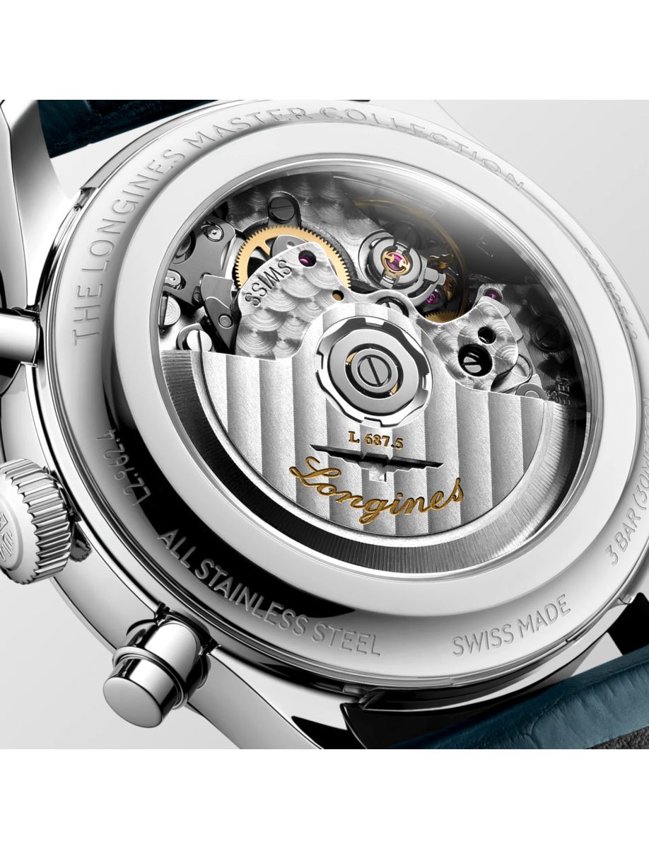 Close-up of a Longines watch movement visible through a transparent caseback, with gears and rotor in view.