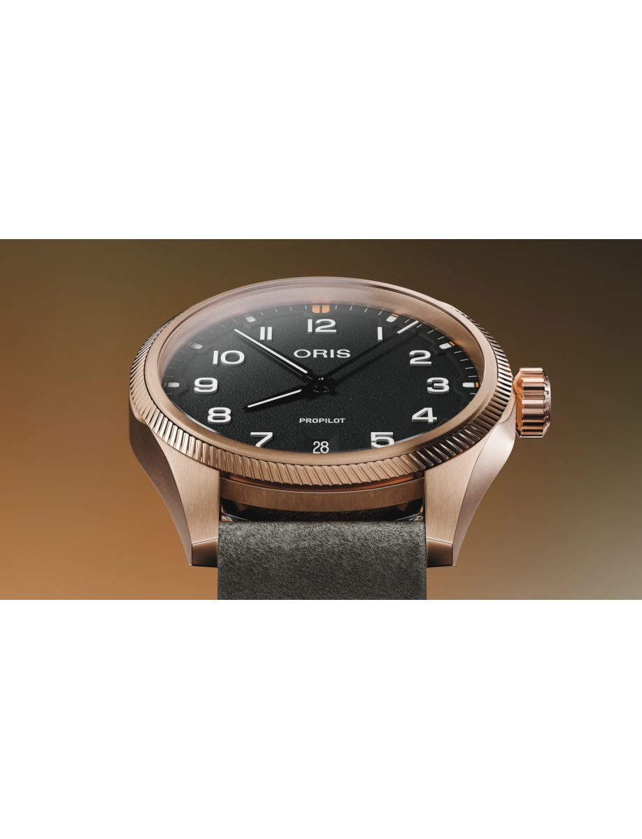 Bronze Oris wristwatch with black dial and textured bezel, shown in close-up.