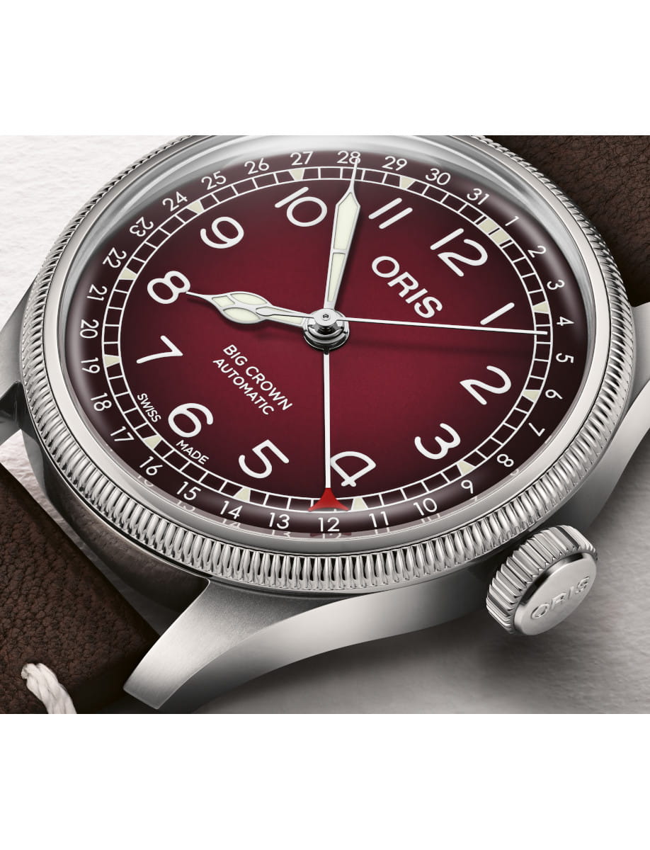Close up view of Side view of Oris Big Crown Automatic wristwatch with burgundy dial, luminous numerals.