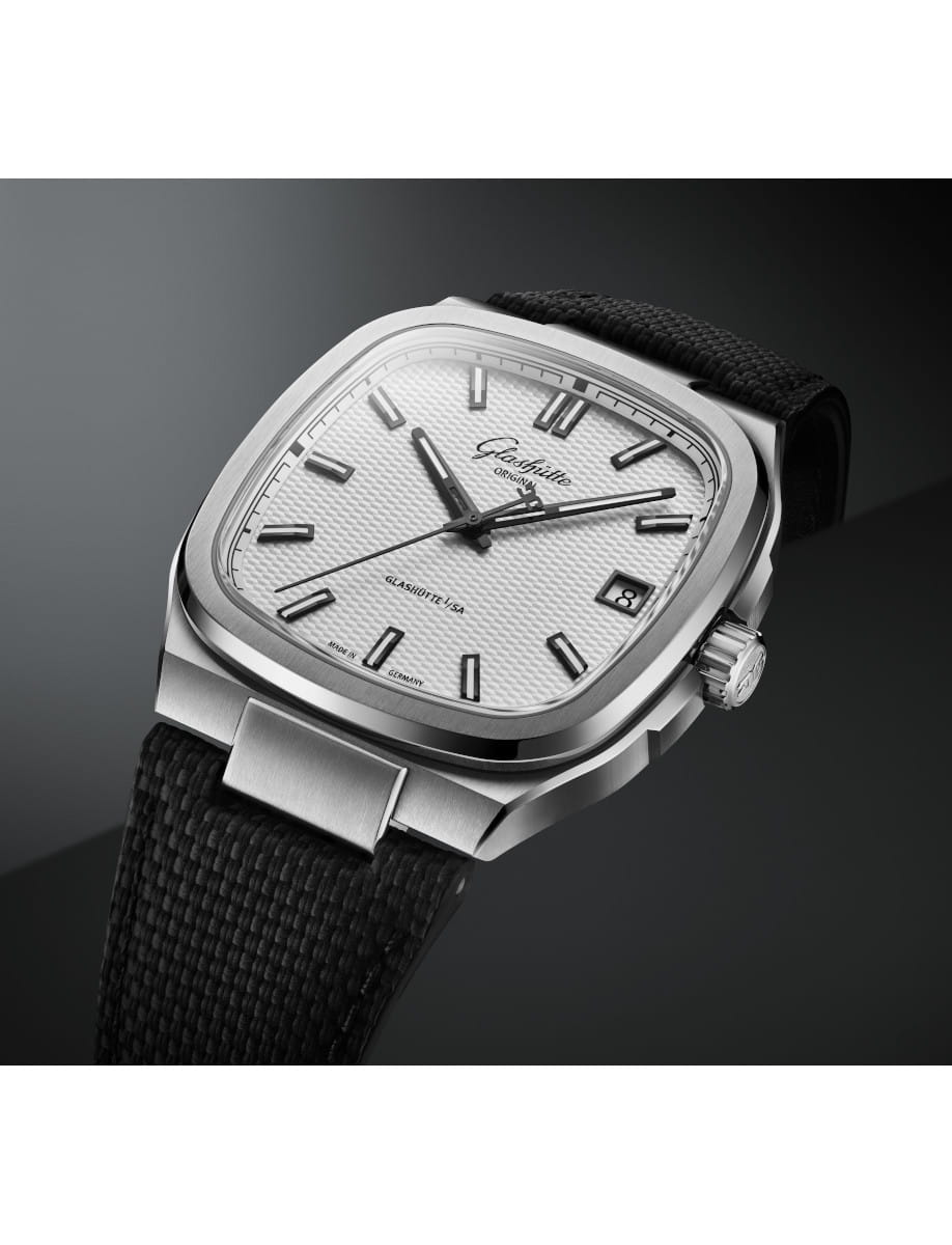 Side view of Glasshute Original stainless steel wristwatch with a silvern galvanized dial, stainless steel case, and black rubber strap.