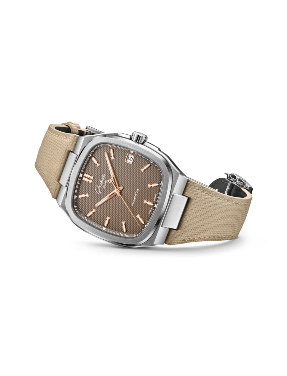 Side view of Glashütte watch with stainless steel case, beige rubber strap, brown galvanized dial, date window at 3 o'clock.