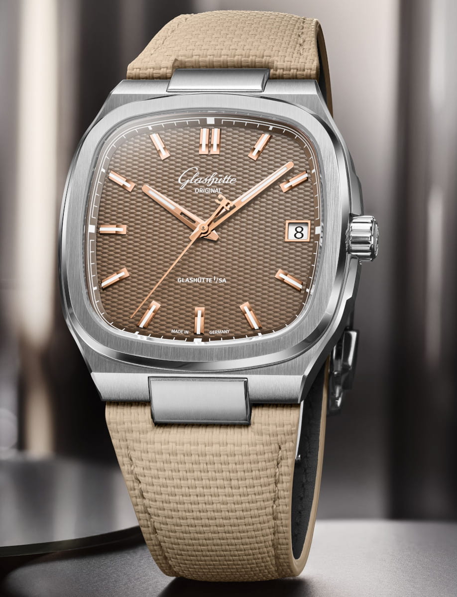 Close-up of a Glashütte Original wristwatch with a brown galvanized dial, and a beige rubber strap