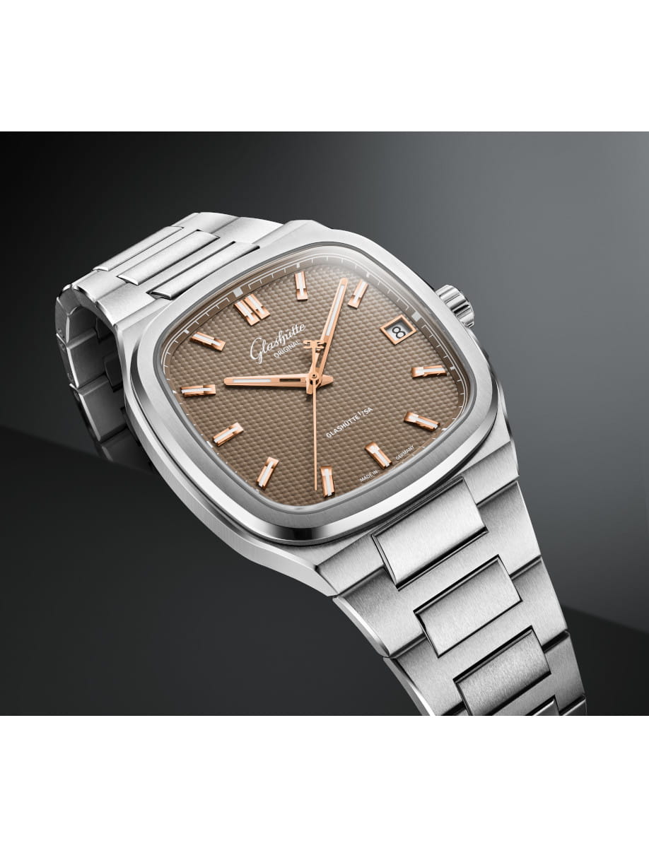 Side view of Glashütte watch with stainless steel case and bracelet, brown galvanized dial, date window at 3 o'clock.