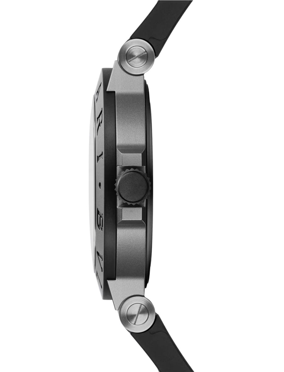Side view of a round wristwatch with a black strap and titanium case