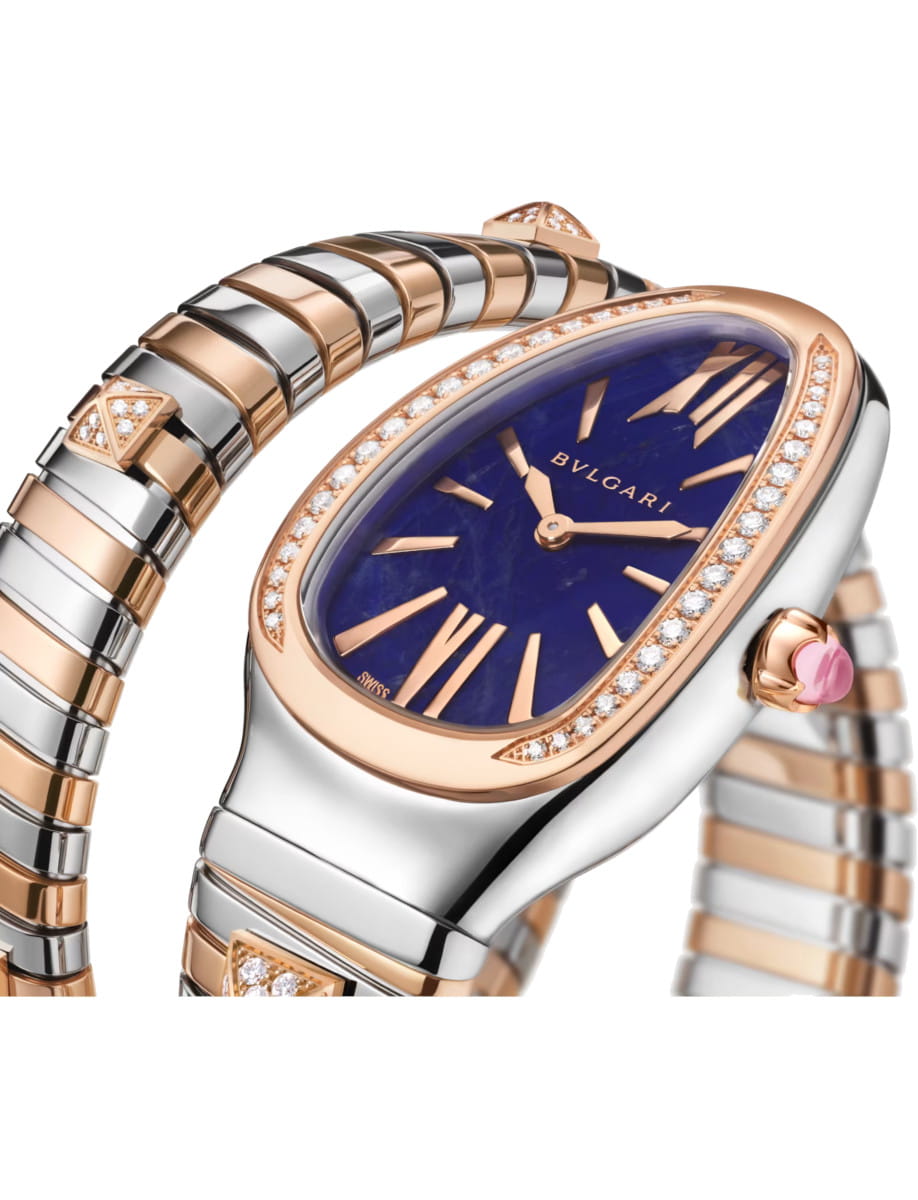 Side view of Bulgari Serpenti watch with a blue dial, rose gold and stainless steel case and bracelet, diamond-set bezel and accents