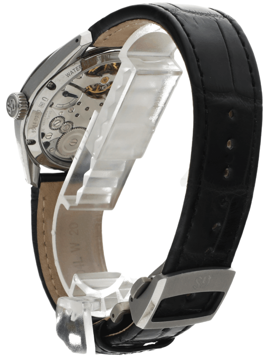 Back view of pre-owned Grand Seiko wristwatch with a stainless steel round case, transparent case back, and a black leather strap.