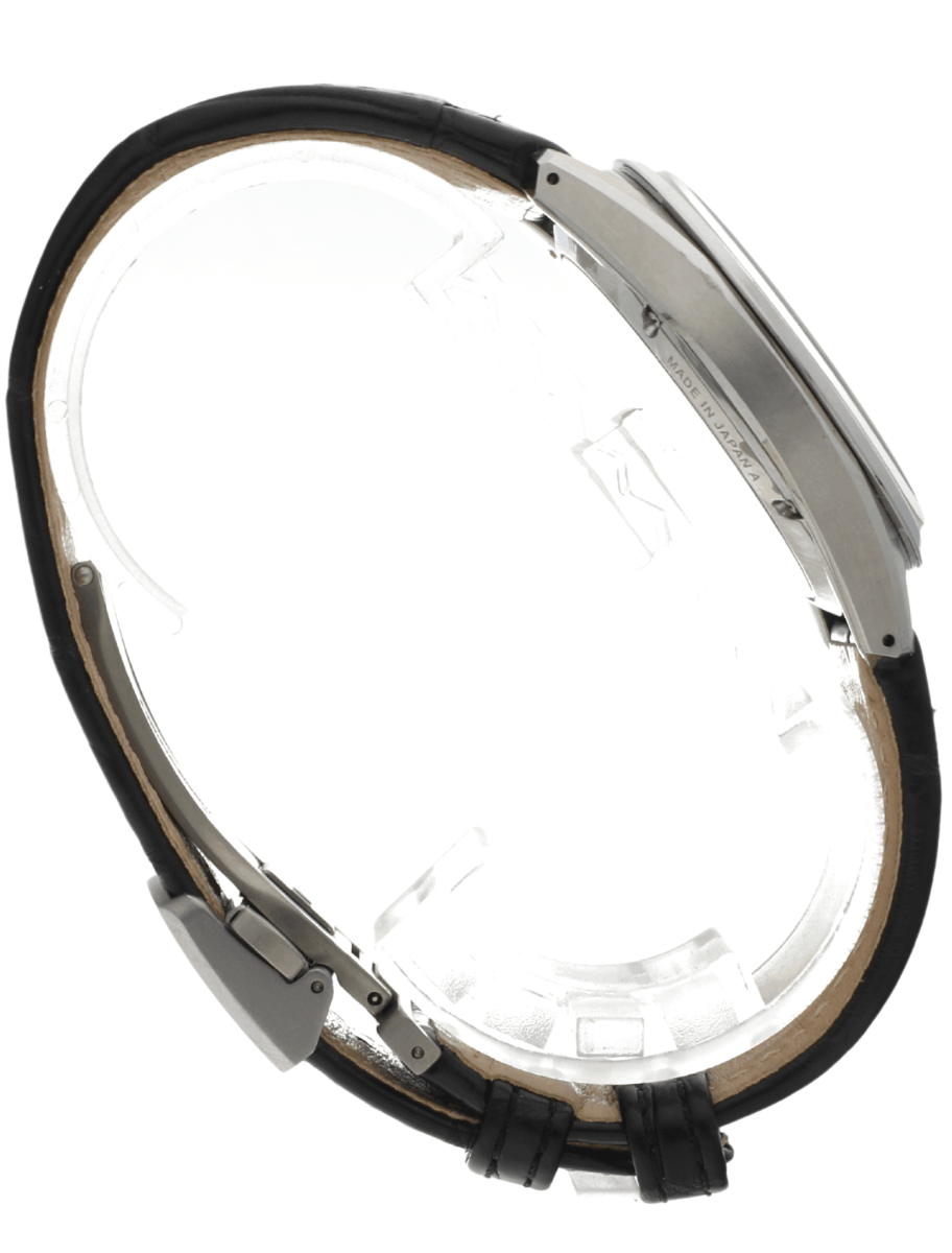 Side view of pre-owned Grand Seiko wristwatch with a stainless steel round case, and a black leather strap.