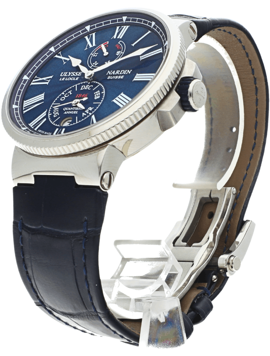 Left side view of pre-owned Ulysse Nardin wristwatch with blue dial, Roman numerals, stainless steel case, and blue leather strap.