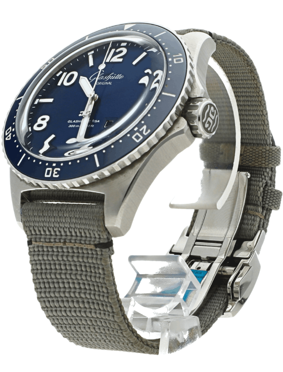 Left side view of Pre-owned Glashutte Original wristwatch with stainless steel case, blue dial, and grey synthetic strap.