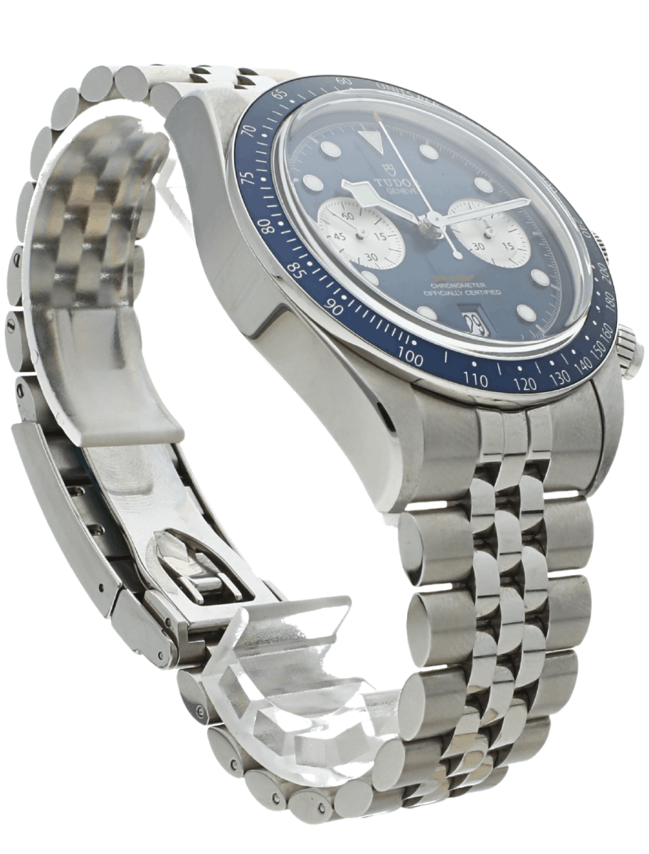 Stainless steel wristwatch with a blue dial and chronograph subdials, shown with a metal link bracelet and open clasp.