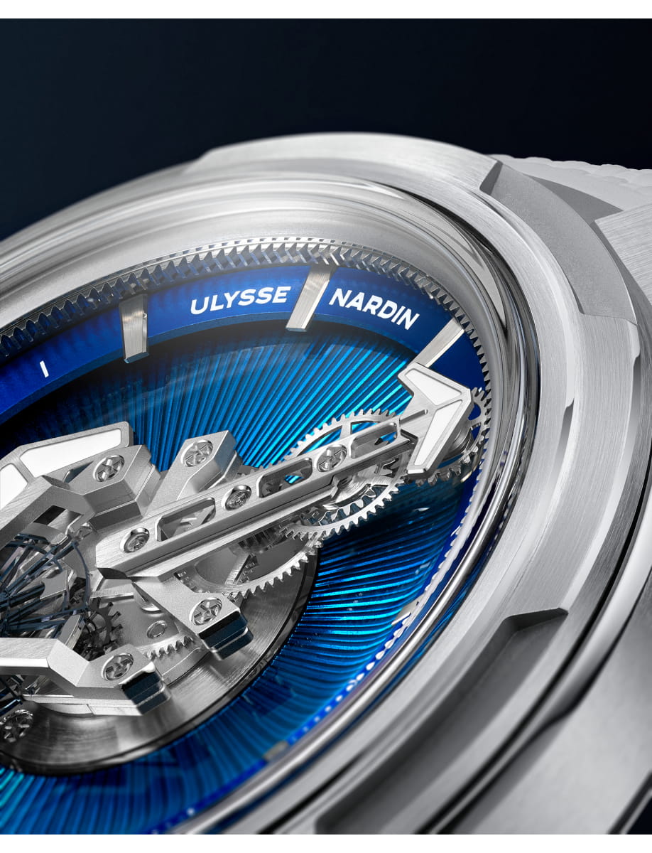 Close up of Ulysse Nardin wristwatch with titanium case, no dial, no hands, no crown.