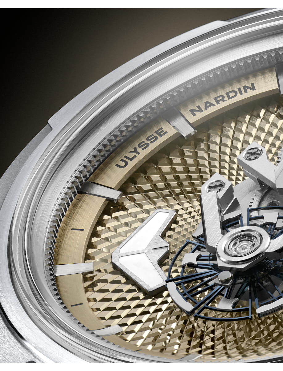 Close up of Ulysse Nardin wristwatch with titanium case, sand color skeleton dial.