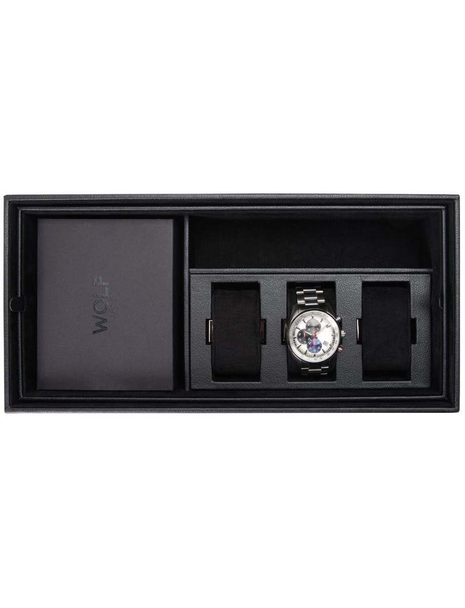 Watch in a black presentation box with metal band and two extra strap compartments; brand card on the left.
