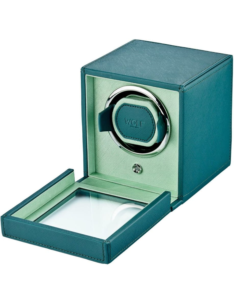 Teal leather watch winder box with a circular rotor inside; bottom drawer extended open for storage. (Can imply it’s a device to wind automatic watches.)