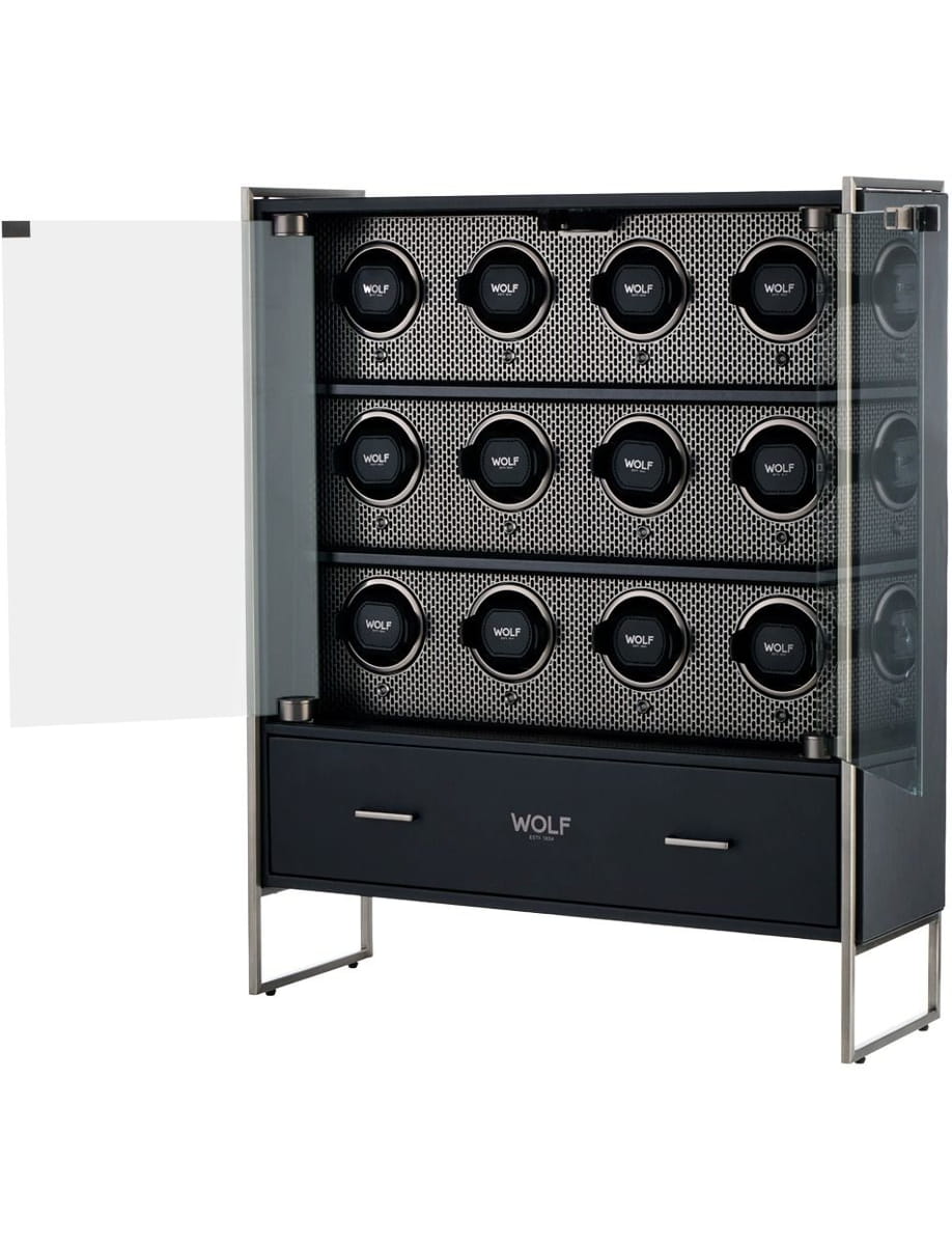 Modern stainless steel Wolf cabinet with glass doors, showing 15 round watch slots and a bottom drawer for storage.