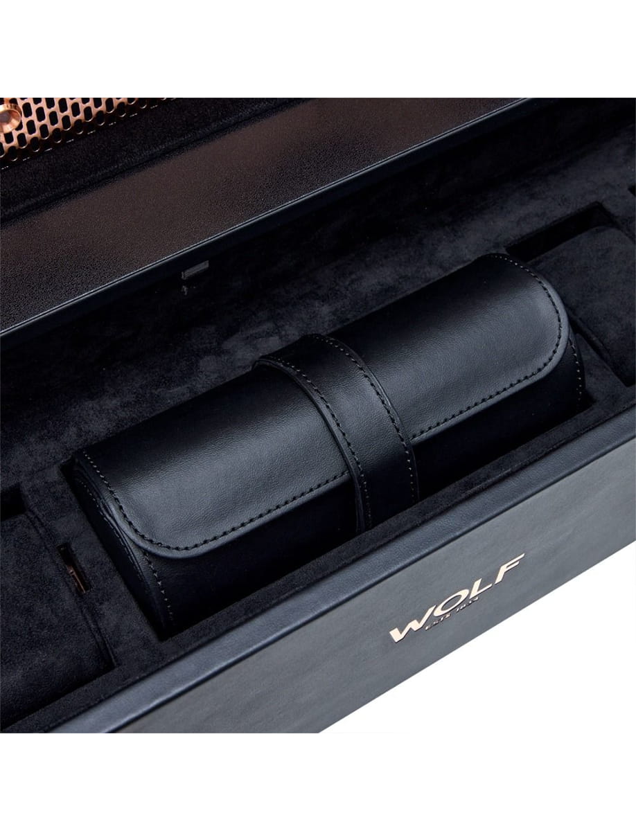 Black leather cylindrical case with a strap, inside a suede-lined display box.