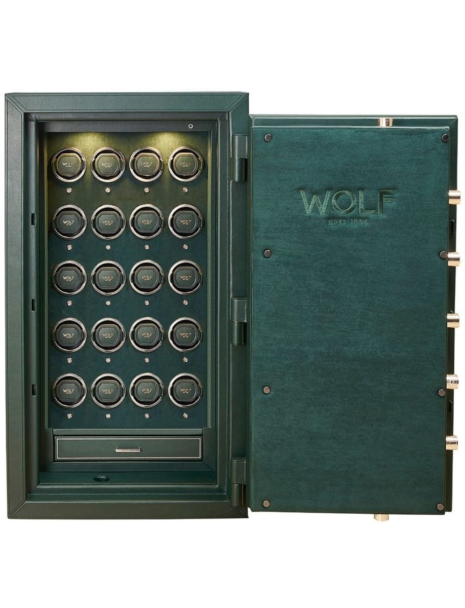 Open green Wolf safe showing multiple small circular compartments and a bottom drawer for valuables.
