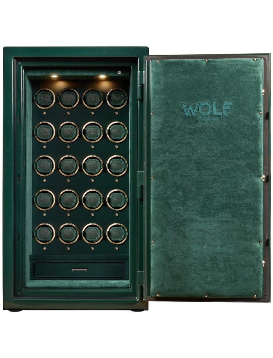 Open green Wolf safe showing multiple round combination locks and a bottom drawer inside the door is closed by a handle and bolts