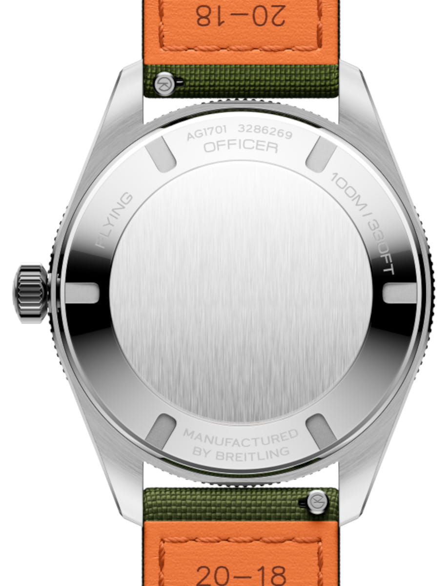 Rear view of a stainless steel watch with a brushed case back, left-side crown, and a green/orange strap; engravings include OFFICER, FLYING, 100M/330FT, and MANUFACTURED BY BREITLING.