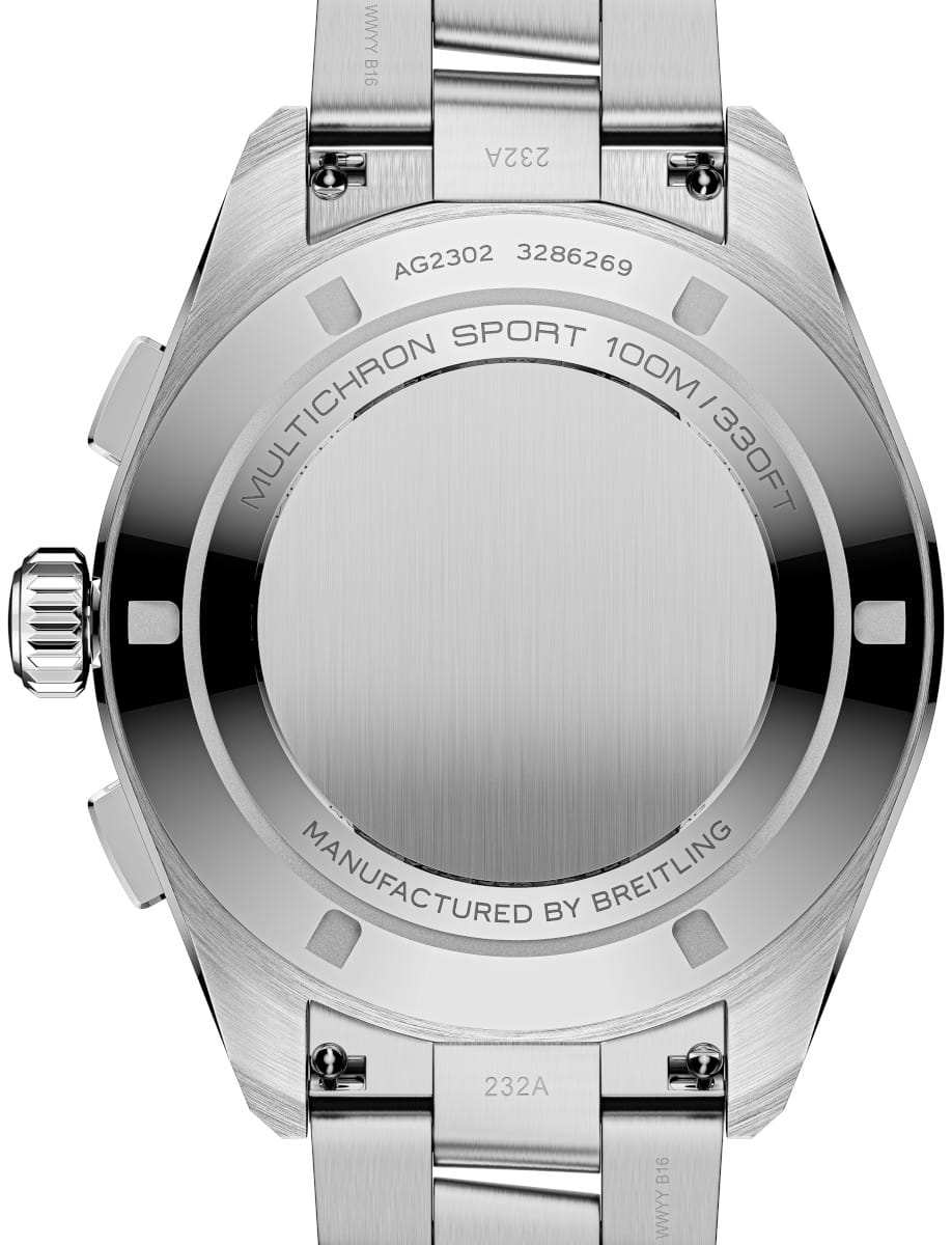 Stainless steel Breitling watch back with engraved model and serial numbers, bracelet links visible in the foreground.