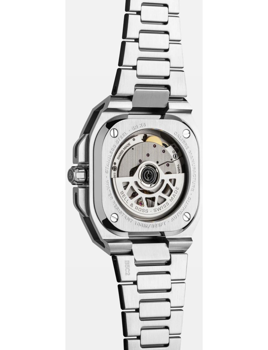 Stainless steel wristwatch with a transparent back, displaying the mechanical movement and rotor inside.